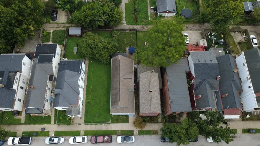 Drone aerial showing the cottage, rear yard, and surrounding Cincinnati neighborhood — photographed by 513Shutter Cincinnati