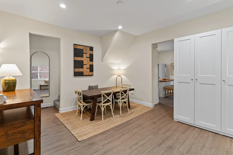 Dining area with wood table, woven chairs, and built-in storage cabinets — photographed by 513Shutter Cincinnati