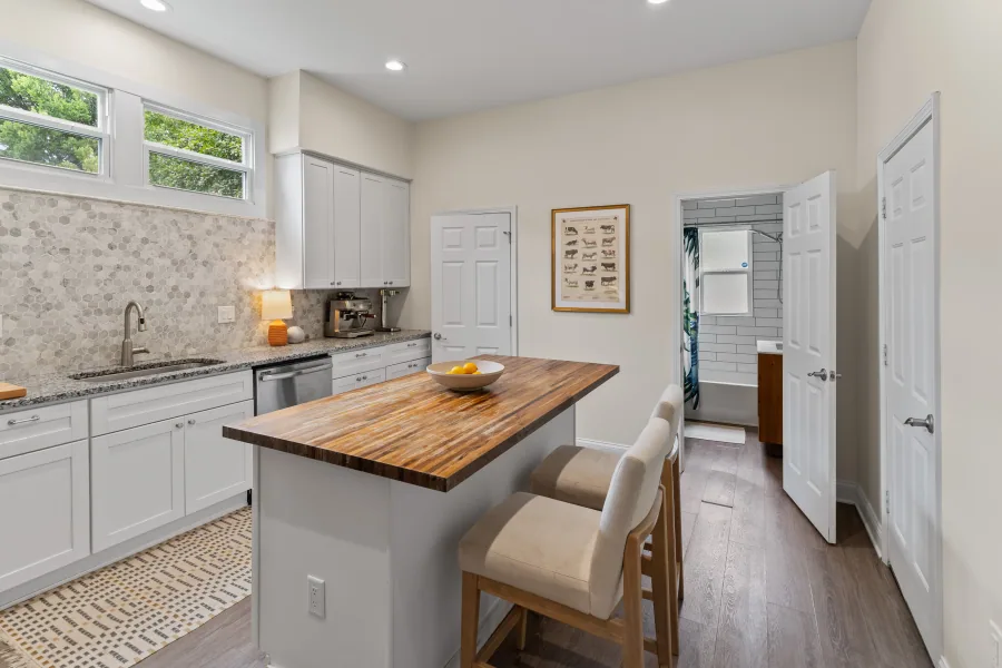Renovated kitchen with butcher block island and counter seating — photographed by 513Shutter Cincinnati