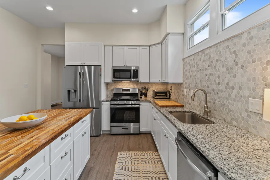 Kitchen range and microwave with hexagon tile backsplash — photographed by 513Shutter Cincinnati