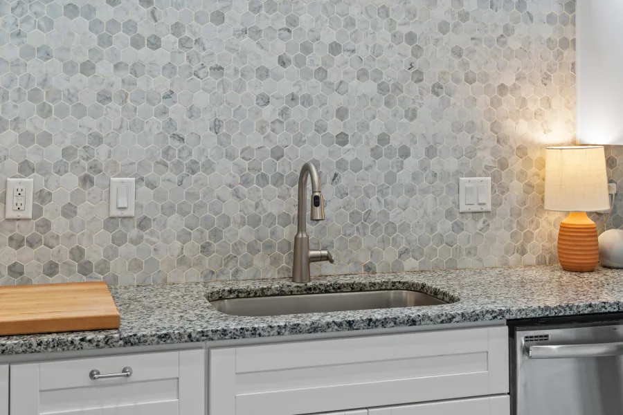 Kitchen sink with gooseneck faucet and hexagon tile backsplash — photographed by 513Shutter Cincinnati