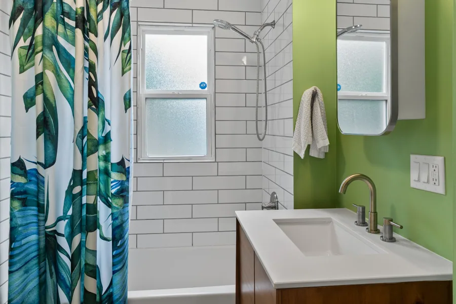 Bathroom shower with subway tile surround and patterned curtain — photographed by 513Shutter Cincinnati