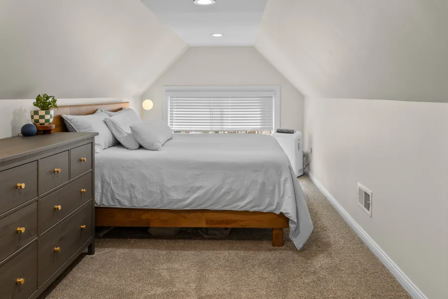 Second bedroom with platform bed, dresser, and neutral finishes — photographed by 513Shutter Cincinnati