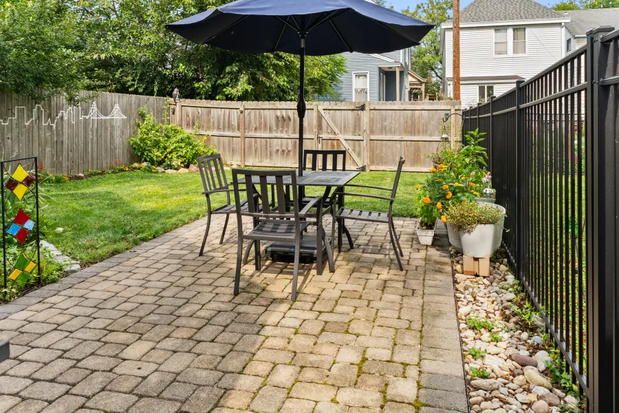 Rear paver patio and seating area with fenced yard beyond — photographed by 513Shutter Cincinnati