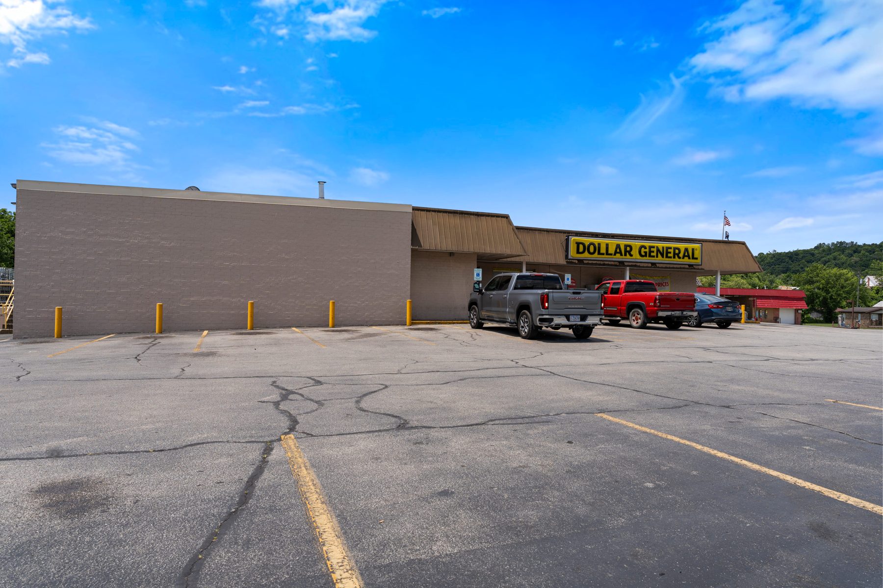 Close storefront view of the Dollar General entrance and signage