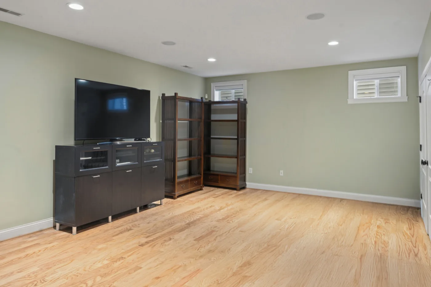 Before: Basement Living Room in Same Listing